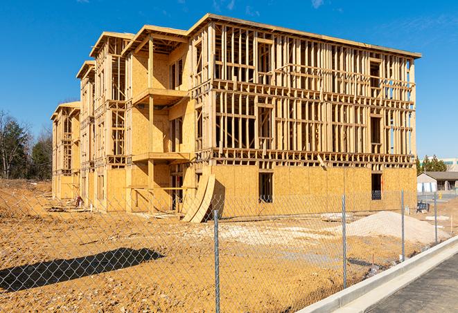 a temporary chain link fence in front of a building under construction, ensuring public safety in Hermosa Beach CA